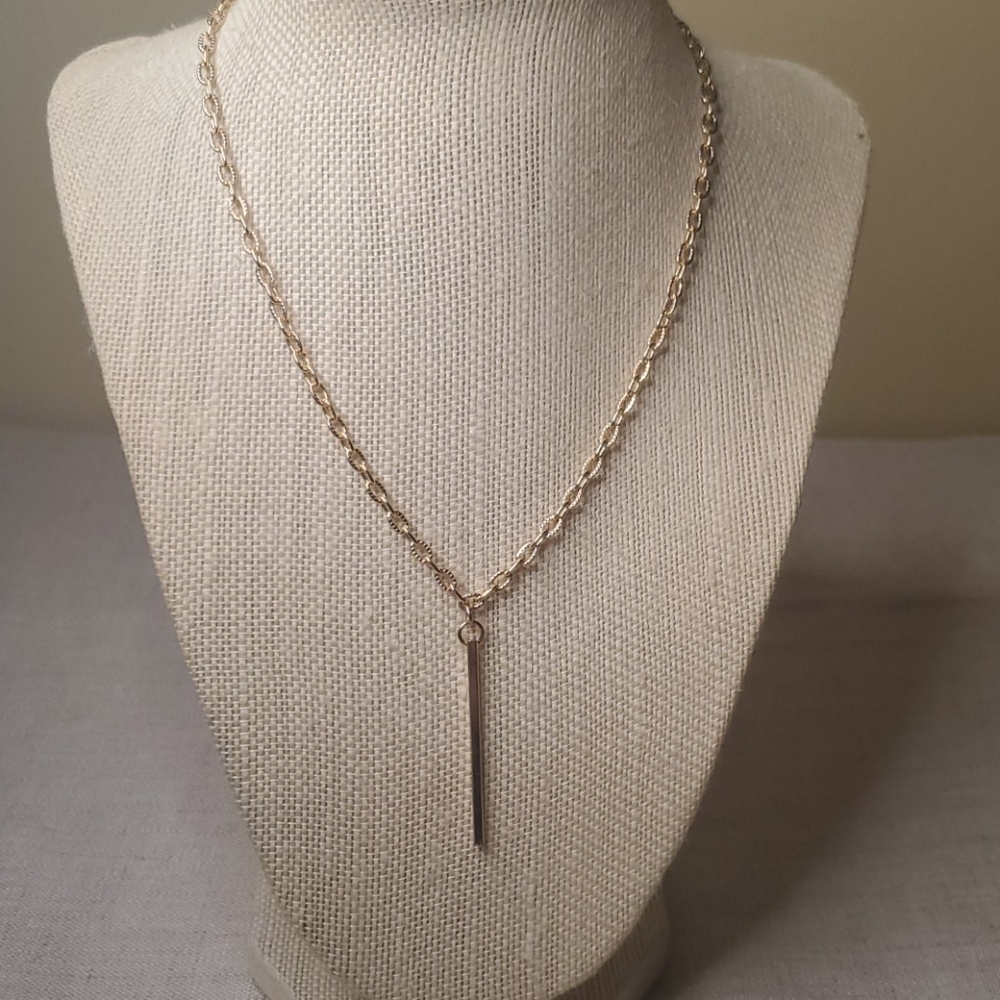 Gold plated necklace with gold bar charm.